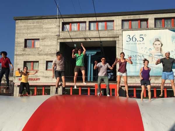 Enlarged view: group jumping on balloon