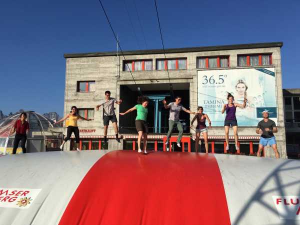 Enlarged view: group jumping on balloon