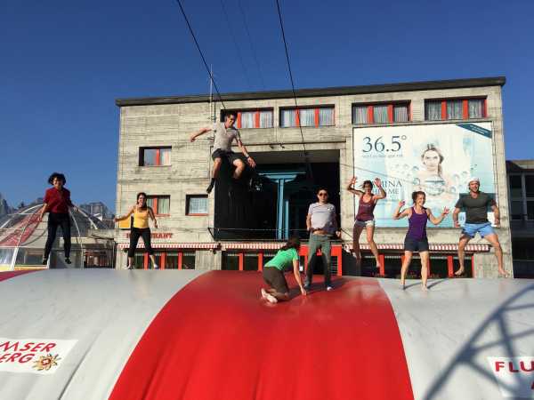 Enlarged view: group jumping on balloon