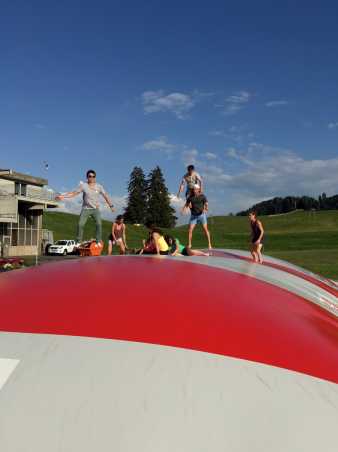 Enlarged view: group jumping on balloon